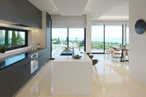 Interiors of the villa designed by our team and developer. 3D renderings were created for a real estate developer to sell the property. View on the kitchen island. Marbella, Spain.