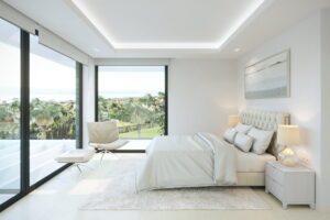 3D rendering of a stylish white bedroom with an unobstructed view of the Alboran Sea, Spain.