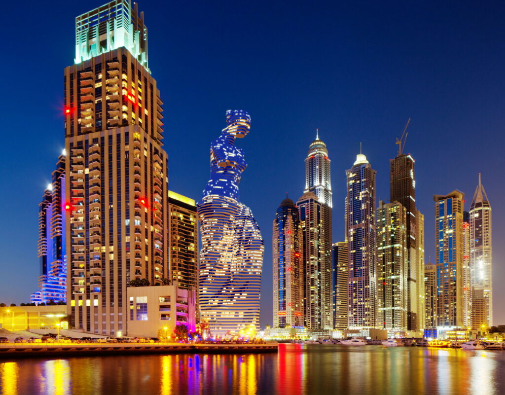 3D rendering of a tower skyscraper in Dubai, UAE, showcasing a nighttime view.