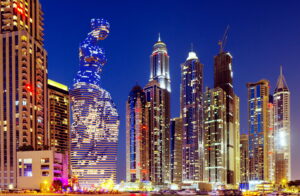 3D rendering of a tower skyscraper in Dubai, UAE, showcasing a nighttime view, close-up.
